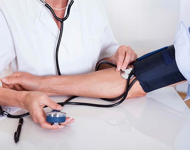 person getting blood pressure checked