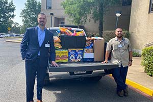 Pictured L-R with cereal donations at NMC are Jeff Patterson, CEO, and for Nacogdoches Medical Center (NMC) and Miguel Loa, NMC Plant Operations.