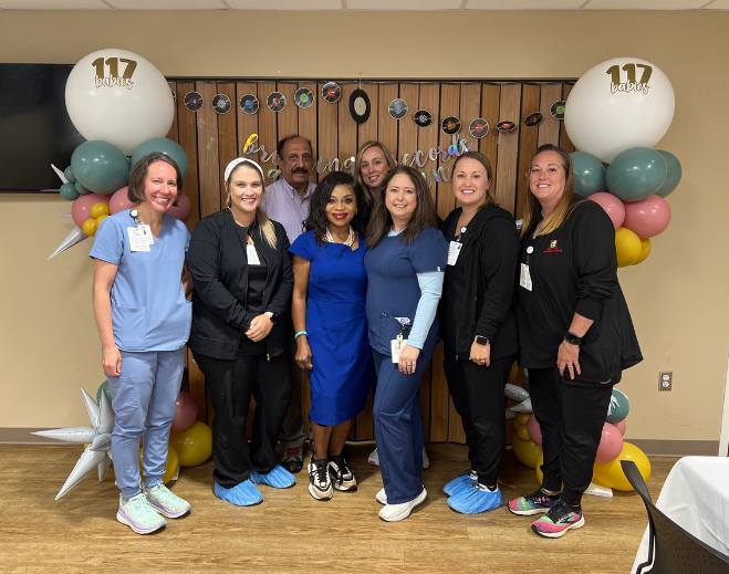 Healthcare team posing at celebration event