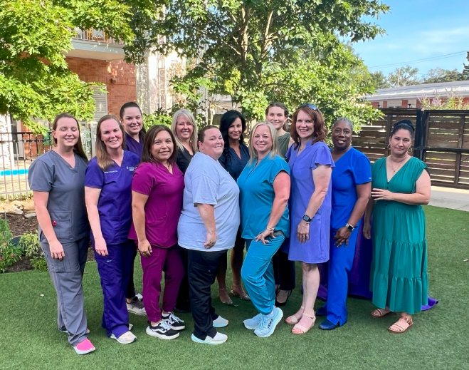 Group of healthcare staff standing outdoors